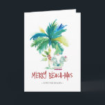 Carte de Noël Tropical Beach<br><div class="desc">Ces cartes de Noël de plage sont ornées d'un palmier exotique d'inspiration insulaire et de Père Noël de vacances mignonnes. Les mots "Merry Beach-mas" sont placés en lettres à la main. Utilisez les champs modèle pour ajouter votre salutation personnalisée. Un choix charmant à envoyer à vos amis et à votre...</div>
