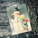 Carte de Noël Vintage Elf et Snowman<br><div class="desc">Voici une mignonne carte de Noël de l'époque victorienne avec l'image d'un elfes de Père Noël tenant une bougie éclairée pour qu'un bonhomme de neige puisse la voir. Amusant de fêter les fêtes de la façon désuète! Customisez facilement le message intérieur selon votre goût, ou laissez-le tel quel. Pour des...</div>