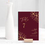 Carte de numéro de table du Mariage Floral Or Bour<br><div class="desc">Cette carte de numéro de table à mariage floral d'or bordeaux présente un somptueux décor de merlot foncé avec une élégante calligraphie dorée et des ornements floraux dorés. L'histoire des couleurs de bijoux et les accents botaniques dorés ainsi qu'un écriture minimaliste et délicate créent une esthétique moderne, royale et romantique,...</div>