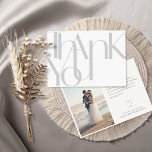 Carte De Remerciements Minimalist Bold Photo light Gray Thank You Card<br><div class="desc">Boldly show your heartfelt appreciation with these simple 7" x 5" wedding thank you cards featuring the words, "Thank you, " in large light gray letters on a white background. The backs of the cards feature a a spot for your favorite photo, little heart along with the message, "with love...</div>