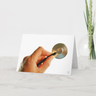 Carte De Remerciements Stéthoscope en main pour une atmosphère d'hôpital.