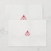 un design de fleur rouge sur un arrière - plan bla