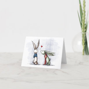 Carte de vacances de lapins d'amour de Noël