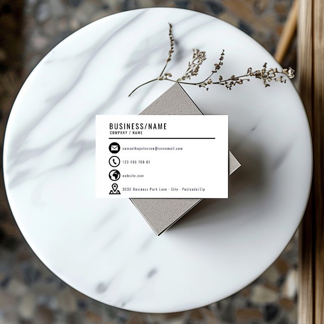 Carte de visite d'icônes noir et blanc (Minimalist black and white business card with bold contact icons and modern layout.)