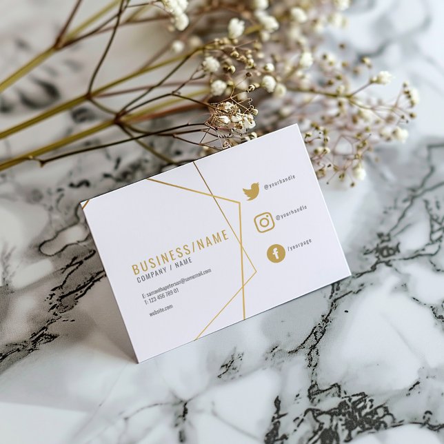 Carte De Visite Réseaux sociaux blanc et or (White business card with gold geometric lines, social icons, and modern typography.)