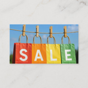 Carte De Visite Sacs de shopping en solde sur une corde à linge
