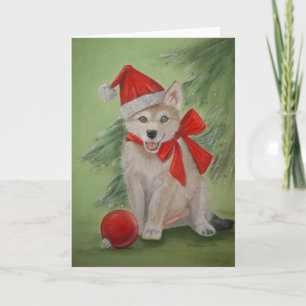 Carte de voeux de chiot de loup de Noël