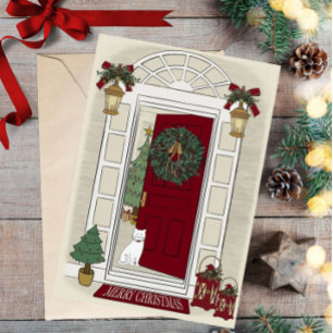 Carte de vœux de Noël avec chat à la porte