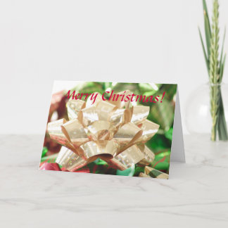 Carte de vœux de Noël avec un nœud doré