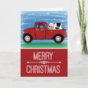 Carte de vœux de Noël vache dans un camion rouge