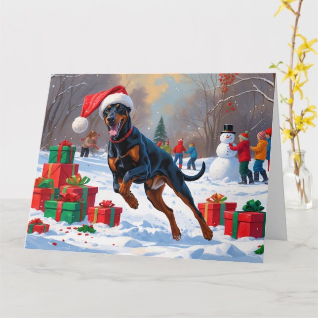 Carte Doberman courant dans la neige avec un chapeau de  (Fleur jaune)