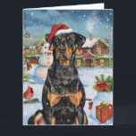 Carte Doberman Winter Wonderland Christmas Joy<br><div class="desc">Ce design festif reflète l'esprit joyeux de la période des fêtes, avec un adorable petit portant un chapeau de Père Noël. Le chien est niché dans un pays des merveilles hivernales, avec un bonhomme de neige, un sapin de Noël décoré et des cadeaux joliment emballés. Les flocons de neige tombent...</div>
