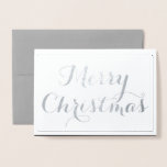 Carte Dorée Élégant Joyeux Script de Noël Typographie Argent<br><div class="desc">Elegant Joyeux Noël Silver Foil Greeting Card fait un choix idéal pour souhaiter des vacances heureuses à votre famille, à vos amis et à vos proches! Véritable feuille d'argent sur le devant de la carte avec "Joyeux Noël" et bordure du cadre À l'intérieur de la carte est audacieux élégant noir...</div>