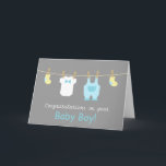 Carte Elegant and Cute Baby Boy Clothes<br><div class="desc">Send your congratulations and well wishes to the new parents of a newborn baby boy with these mini baby clothes and accessories greeting card! This modern design in pastel colours includes cute baby items like yellow baby socks, a white baby jumpsuit with a bow tie and a pastel blue overalls...</div>