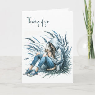 Carte Fille dans un Sweat - shirt à capuche tenant un ch