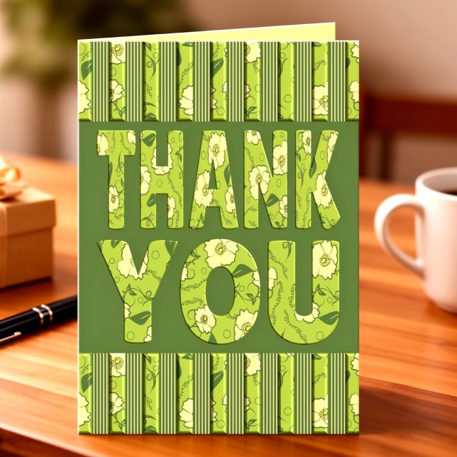 Carte Fleurs jaunes avec rayures vert olive Merci (Bold text filled with lime green flowers, vines and leaves, topped by stripped borders top & bottom.)