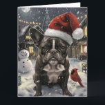 Carte French Bulldog Winter Wonderland Christmas Joie<br><div class="desc">Ce design festif reflète l'esprit joyeux de la période des fêtes, avec un adorable petit portant un chapeau de Père Noël. Le chien est niché dans un pays des merveilles hivernales, avec un bonhomme de neige, un sapin de Noël décoré et des cadeaux joliment emballés. Les flocons de neige tombent...</div>