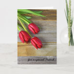 Carte Friend's birthday wishes with red tulips<br><div class="desc">Red tulips with water droplets on wood for Friend's birthday.</div>