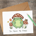 Carte Grenouille mignonne et champignon | Vous Me Faites<br><div class="desc">Cette mignonne carte de voeux présente une grenouille dessinée à la main de style kawaii,  portant un casquette de champignon,  ainsi que d'autres champignons,  un escargot,  une fleur,  un papillon et de l'herbe. Le texte dit,  "Vous me faites Hoppy" mais peut être customisé,  si désiré.</div>