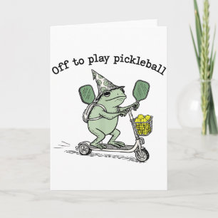 Carte Grenouille sorcier tenant une raquette Trottinette