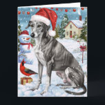 Carte Greyhound Winter Wonderland Christmas Joie<br><div class="desc">Ce design festif reflète l'esprit joyeux de la période des fêtes, avec un adorable petit portant un chapeau de Père Noël. Le chien est niché dans un pays des merveilles hivernales, avec un bonhomme de neige, un sapin de Noël décoré et des cadeaux joliment emballés. Les flocons de neige tombent...</div>
