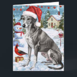 Carte Greyhound Winter Wonderland Christmas Joie<br><div class="desc">Ce design festif reflète l'esprit joyeux de la période des fêtes, avec un adorable petit portant un chapeau de Père Noël. Le chien est niché dans un pays des merveilles hivernales, avec un bonhomme de neige, un sapin de Noël décoré et des cadeaux joliment emballés. Les flocons de neige tombent...</div>