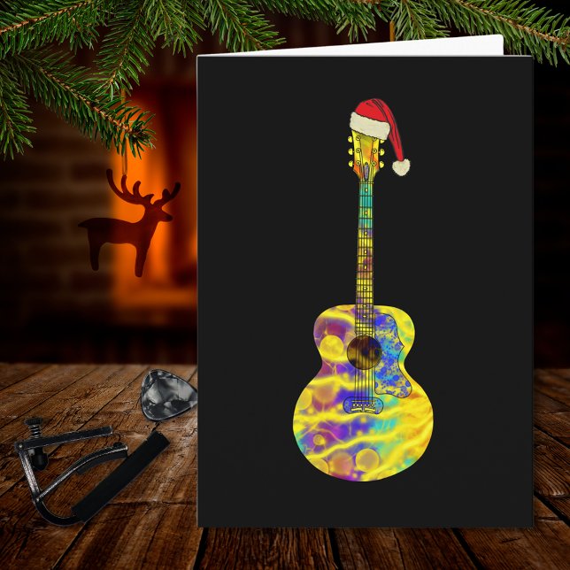 Carte guitare Père Noël Colorée (Funky Christmas guitar wearing a Santa hat on black music themed holiday greetings card musician)
