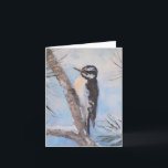 Carte Hiver Pic Beaux Art Toutes les occasions<br><div class="desc">Un petit pic pose contre une branche de pins,  avec une chaude lueur d'hiver en après-midi illuminant l'arrière - plan enneigé. L'image provient d'une peinture à l'huile originale de l'artiste primée Debra Mickelson. L'intérieur de cette carte est vide pour votre propre message.</div>