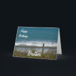 Carte Joyeux anniversaire Brother-Ocean Waves<br><div class="desc">C'est une belle carte pour l'anniversaire de votre frère, avec une vue sur les vagues bleues de l'océan, vue à travers une clôture avec du gazon de plage agitant dans le vent. A l'intérieur est un joli verset que vous pouvez bien sûr customiser/personnaliser pour répondre à vos besoins! Vous pouvez...</div>