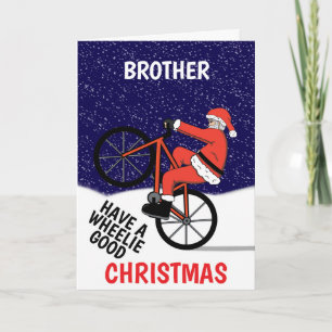 Carte Joyeux Noël drôle en vélo Père Noël