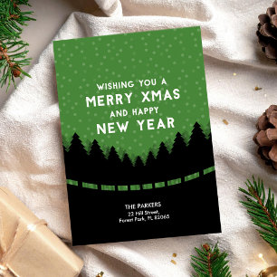 Carte Joyeux Noël vert avec des arbres et de la neige