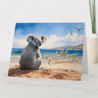 Koala sur une plage de sable Joyeux Noël