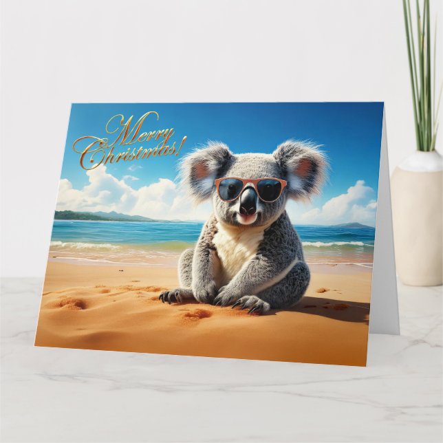 Carte Koala sur une plage de sable Joyeux Noël (Devant)