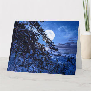 Carte Lune sur le sapin enneigé et la côte de la mer la 