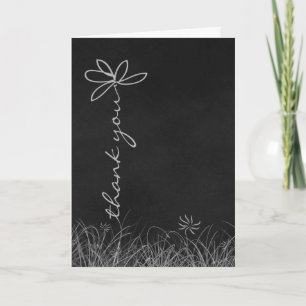 Carte merci daisy sur le tableau noir