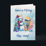 Carte Merry Disk-mas | Disk Golf Personnalisé Noël<br><div class="desc">Carte de Noël sur le thème du golf sur disque personnalisé. Joli bonhomme de neige en aquarelle à Santa chapeau à côté d'un panier de golf dans la neige à côté d'un sapin de Noël.</div>