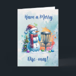 Carte Merry Disk-mas | Disk Golf Personnalisé Noël<br><div class="desc">Carte de Noël sur le thème du golf sur disque personnalisé. Joli bonhomme de neige en aquarelle à Santa chapeau à côté d'un panier de golf dans la neige à côté d'un sapin de Noël.</div>