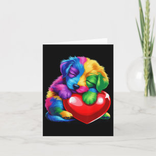 Carte Mignon chiot arc-en-ciel étreignant le cœur de la 