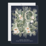 Carte Noël Noel Winter Pine Botanique Neige<br><div class="desc">Noel est épelé en lettres de parties scintillant argentées ornées de fleurs blanches. Ils sont nichés dans des branches de pins d'hiver qui sont enneigées. Deux lignes de texte blanc sont ci-dessous et vous permettent de personnaliser votre message. L'arrière - plan bleu foncé les rend vraiment pop.</div>