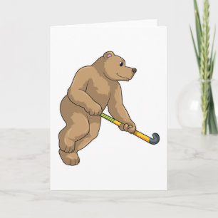 Carte Ours au hockey avec une batte de hockey