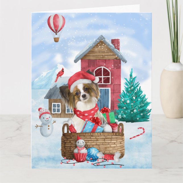 Carte Papillon Chien dans la maison de Noël enneigée (Devant)