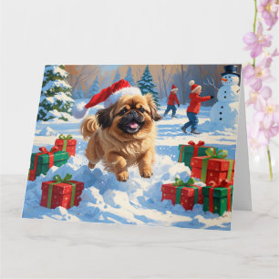 Carte Pekingese Chien courant dans la neige avec le Casq