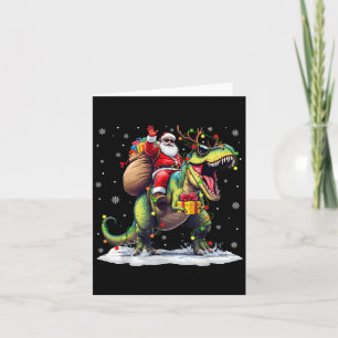 Carte Père Noël à cheval sur un dinosaure T Rex Noël Gar