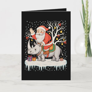 Carte Père Noël chevauchant Rhinocéros Neige Lumières de