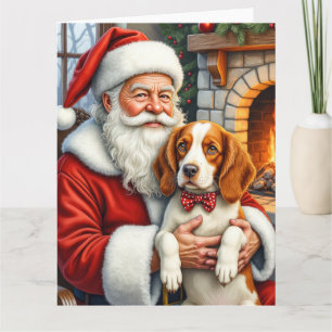 Carte Père Noël tenant l'art de Noël d'un épagneul breto