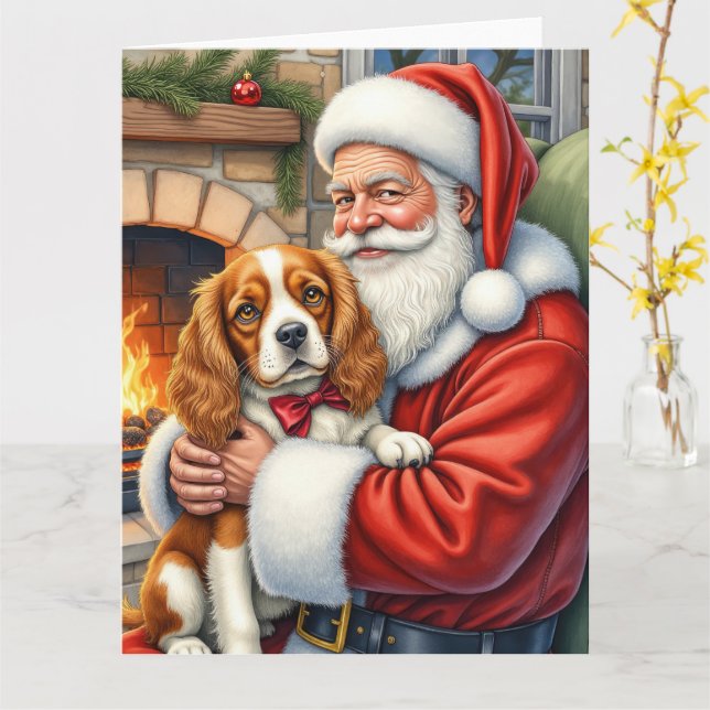 Carte Père Noël tenant un Cavalier King Charles Spaniel  (Fleur jaune)