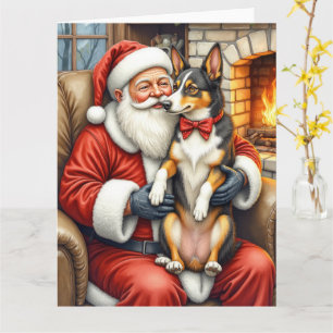 Carte Père Noël tenant un Kelpie australien à Noël