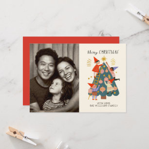 Carte Photo d'elfes de Noël joyeux décorant un arbre 