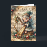 Carte Pixie Fairy de Noël Jouer une harpe<br><div class="desc">Une fée délicate ornée d'accents floraux joue une harpe contre un arrière - plan de notes musicales Texte à changer.</div>