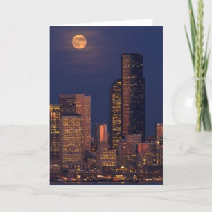 Carte Pleine lune se levant au-dessus de l'horizon du